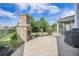 Outdoor patio with a stone fireplace, backyard, well-maintained landscaping, and fenced lawn at 246 Calm Water Way, Summerville, SC 29486