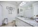 Bathroom featuring double sinks, granite countertops, a large mirror, and towel racks at 246 Calm Water Way, Summerville, SC 29486