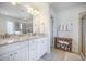 Bright and spacious bathroom featuring double vanity sinks with granite countertops and storage at 246 Calm Water Way, Summerville, SC 29486