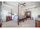 A bedroom featuring a four-poster bed, ceiling fan, and classic wood furniture at 246 Calm Water Way, Summerville, SC 29486