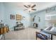 Bedroom with blue walls featuring musical decor, large windows, and neutral carpet at 246 Calm Water Way, Summerville, SC 29486