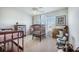 Neutral bedroom with a crib, side table, ceiling fan and plenty of natural light at 246 Calm Water Way, Summerville, SC 29486