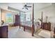 Spacious bedroom with a four-poster bed, tray ceiling and large windows for plenty of natural light at 246 Calm Water Way, Summerville, SC 29486