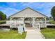 Private boat dock with a covered structure, a quiet and secluded amenity for residents to enjoy lakeside activities at 246 Calm Water Way, Summerville, SC 29486