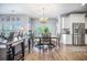 Dining Area with natural light and stainless steel kitchen in the background at 246 Calm Water Way, Summerville, SC 29486