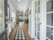 Inviting foyer with hardwood floors, french doors, and a charming console table with decorative accents at 246 Calm Water Way, Summerville, SC 29486