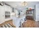 The kitchen has white cabinets, stainless steel appliances, granite countertops, and hardwood floors at 246 Calm Water Way, Summerville, SC 29486