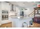 The kitchen features white cabinets, granite countertops, an island, and stainless steel appliances at 246 Calm Water Way, Summerville, SC 29486