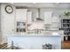 A well-appointed kitchen island boasts granite countertops, white cabinetry, and modern stainless steel appliances at 246 Calm Water Way, Summerville, SC 29486