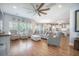 Open concept living room with plenty of natural light and hardwood floors at 246 Calm Water Way, Summerville, SC 29486