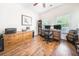 Bright home office with hardwood floors, natural light, and a functional layout for productivity at 246 Calm Water Way, Summerville, SC 29486