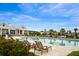 Relaxing pool area featuring lounge chairs and shaded seating under a covered pavilion, perfect for community gatherings at 246 Calm Water Way, Summerville, SC 29486