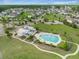 A beautiful community pool with lounge chairs and a covered patio area in a well-maintained neighborhood at 246 Calm Water Way, Summerville, SC 29486