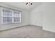 A spacious bedroom with neutral carpet, a ceiling fan, and a large closet at 302 Elm Hall Cir, Summerville, SC 29483