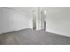 Neutral carpeted bedroom with multiple closets and doors to hallway and bathroom at 302 Elm Hall Cir, Summerville, SC 29483