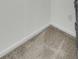 A close-up of the neutral carpet, wall, and trim at 302 Elm Hall Cir, Summerville, SC 29483