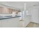 Bright kitchen featuring white appliances, light wood cabinets, and an open counter area at 302 Elm Hall Cir, Summerville, SC 29483