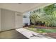 Covered patio area with green foliage at 302 Elm Hall Cir, Summerville, SC 29483
