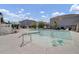 Outdoor community pool and lounge area surrounded by residential homes and ample seating at 302 Elm Hall Cir, Summerville, SC 29483