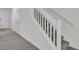 Staircase with white banister and neutral carpet at 302 Elm Hall Cir, Summerville, SC 29483