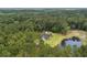Stunning aerial view of a secluded home surrounded by lush greenery and a serene pond at 3113 Edenvale Rd, Johns Island, SC 29455