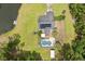 Overhead perspective showing a home with a pool and pond nestled amidst dense, mature trees at 3113 Edenvale Rd, Johns Island, SC 29455