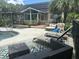 Inviting backyard with pool, lounge chairs, and well-manicured landscaping at 3113 Edenvale Rd, Johns Island, SC 29455