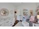 Serene Bedroom featuring a changing table, cozy chair, and decorative bookshelf at 3113 Edenvale Rd, Johns Island, SC 29455