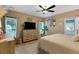 Cozy bedroom featuring neutral tones, modern dresser, ceiling fan, and ample natural light at 3113 Edenvale Rd, Johns Island, SC 29455