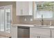 Bright kitchen features white cabinets, stainless steel appliances, and sleek countertops at 3113 Edenvale Rd, Johns Island, SC 29455