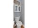 Powder room featuring a toilet, white cabinet and fresh neutral paint at 3113 Edenvale Rd, Johns Island, SC 29455
