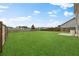 Expansive backyard with lush green grass and a wood fence enclosing the property at 320 Blue Shadows Ct, Summerville, SC 29486