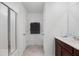 This bathroom showcases a shower with glass doors and a dark brown towel rack at 320 Blue Shadows Ct, Summerville, SC 29486