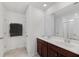 Bathroom featuring double sinks, a large mirror, and dark brown wooden cabinets at 320 Blue Shadows Ct, Summerville, SC 29486
