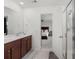 An ensuite bathroom with double sinks and an open door to the bedroom and shower at 320 Blue Shadows Ct, Summerville, SC 29486