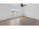 Bright bedroom with large windows and wood look floors provides natural light and a modern touch at 320 Blue Shadows Ct, Summerville, SC 29486