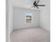 Bright bedroom with large window and carpeted floors provides natural light and a comfortable feel at 320 Blue Shadows Ct, Summerville, SC 29486