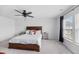 This bedroom features a ceiling fan, a window with blinds, and neutral wall colors at 320 Blue Shadows Ct, Summerville, SC 29486