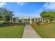 Picturesque community area with a pergola, benches, and lush landscaping for residents to relax and socialize at 320 Blue Shadows Ct, Summerville, SC 29486