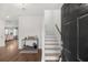 Inviting foyer featuring wood floors and a staircase leading to the upper level at 320 Blue Shadows Ct, Summerville, SC 29486