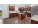 Beautiful kitchen with an island, granite countertops, stainless appliances, and wood floors at 320 Blue Shadows Ct, Summerville, SC 29486