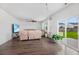 Bright and airy living room with wood floors and sliding door access to backyard at 320 Blue Shadows Ct, Summerville, SC 29486