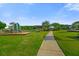 Inviting playground with a playset, swings, and picnic tables for Gathering fun and relaxation at 320 Blue Shadows Ct, Summerville, SC 29486
