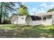 Spacious backyard featuring outbuildings and ample space for outdoor activities and storage at 3249 Stonehaven Dr, North Charleston, SC 29420
