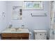 Cozy blue bathroom featuring a wood vanity, overhead lighting and a framed mirror at 3249 Stonehaven Dr, North Charleston, SC 29420
