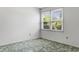 A cozy bedroom featuring a large window, carpet, and a bright, neutral color scheme at 3249 Stonehaven Dr, North Charleston, SC 29420