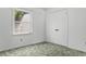 A bright bedroom with a double closet, a large window, and neutral walls and carpet at 3249 Stonehaven Dr, North Charleston, SC 29420