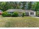 Charming single-story home features lush front yard and a mix of brick and siding exterior at 3249 Stonehaven Dr, North Charleston, SC 29420