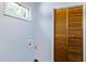 Laundry room has a window, light blue walls, wood bi-fold doors and a washer hook up at 3249 Stonehaven Dr, North Charleston, SC 29420