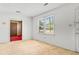 Bright living room features a large window, neutral carpet, and a view to the entry way at 3249 Stonehaven Dr, North Charleston, SC 29420